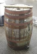 A vintage coopered wooden beer barrel.