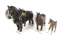 Three Beswick figures of horses. One in riding attire, Max.