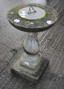 A stone garden sundial.