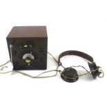A vintage 'Cat's Whisker' crystal radio receiver set with earphones.