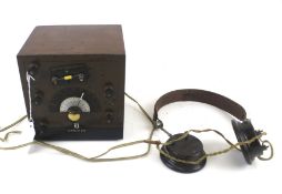 A vintage 'Cat's Whisker' crystal radio receiver set with earphones.
