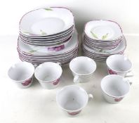 A thirty two piece tea and dinner service. Including cups and saucers, plates, dishes, etc.