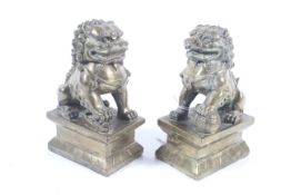A pair of Chinese brass temple dogs.