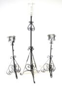 A vintage wrought iron standard lamp and a pair of similar plant stands. Each on tripod stands, Max.