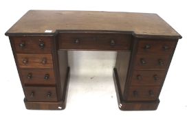 A mahogany veneered reverse break-front twin pedestal desk.
