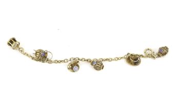 A Portuguese .833 standard silver gilt 'charm' bracelet.