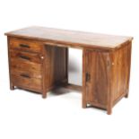 A hardwood twin pedestal desk.