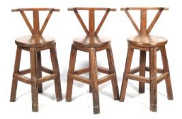 Three solid hardwood bar stools.