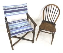 An Ercol dining chair and a folding garden chair.