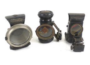 Three vintage bicycle lamps.