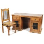 A hardwood pedestal desk and chair. The chair with metalwork details.