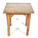 A hardwood square top table.