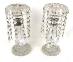 A pair of Victorian clear crystal lustre candlesticks.