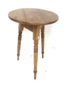 A vintage pine cricket table.