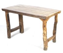 A solid hardwood rectangular dining table.