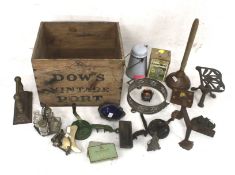 An assortment of vintage items in a 'Dows Port' wooden crate.