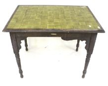 A vintage green tile top oak table. Raised on turned tapered supports, H73cm x W85cm x D56.