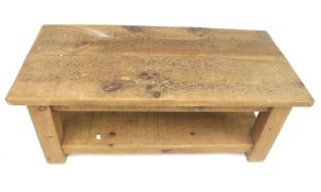 A contemporary wooden plank top coffee table.