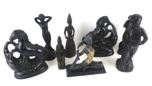 Eight black glazed ornaments and figures.