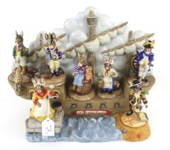 A Royal Doulton 'HMS Bunnykins' ship and seven shipmate figures.