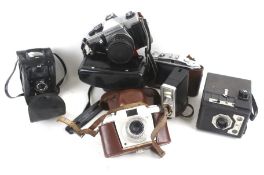 An assortment of cameras, lenses and accessories.