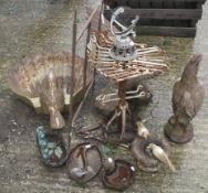 A collection of assorted cast metal garden ornaments.