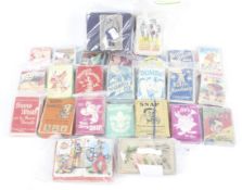 A collection of assorted vintage children's card games.