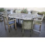 A teak extending garden table,