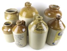 Seven saltglazed stoneware jars and flagons. Including one stamped '2 Neatham Yeovil'. Max.