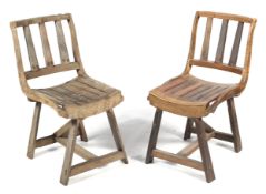 A pair of rustic hardwood chairs.