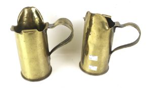 Trench Art - a pair of 1910 and 1915 brass shell case jugs.