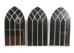 A set of three wall mirrors.