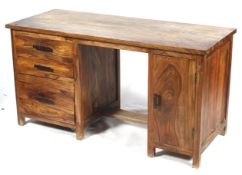 A hardwood twin pedestal desk.