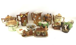 An assortment of ceramics. Including Wade Whimsies, Cottageware, Hornsea vases, etc. Max.