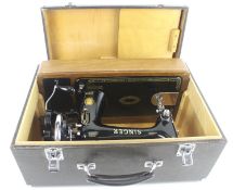 A vintage cased Singer 99K sewing machine with hand crank. Model S/n. EJ697815, boxed.