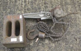 A vintage chain winch and a 56lb metal weight.