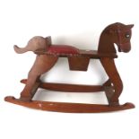 A vintage scratch built plywood rocking horse.