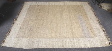 A large coarse woven rug.