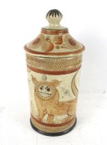 A hand painted Mexican storage jar and lid.