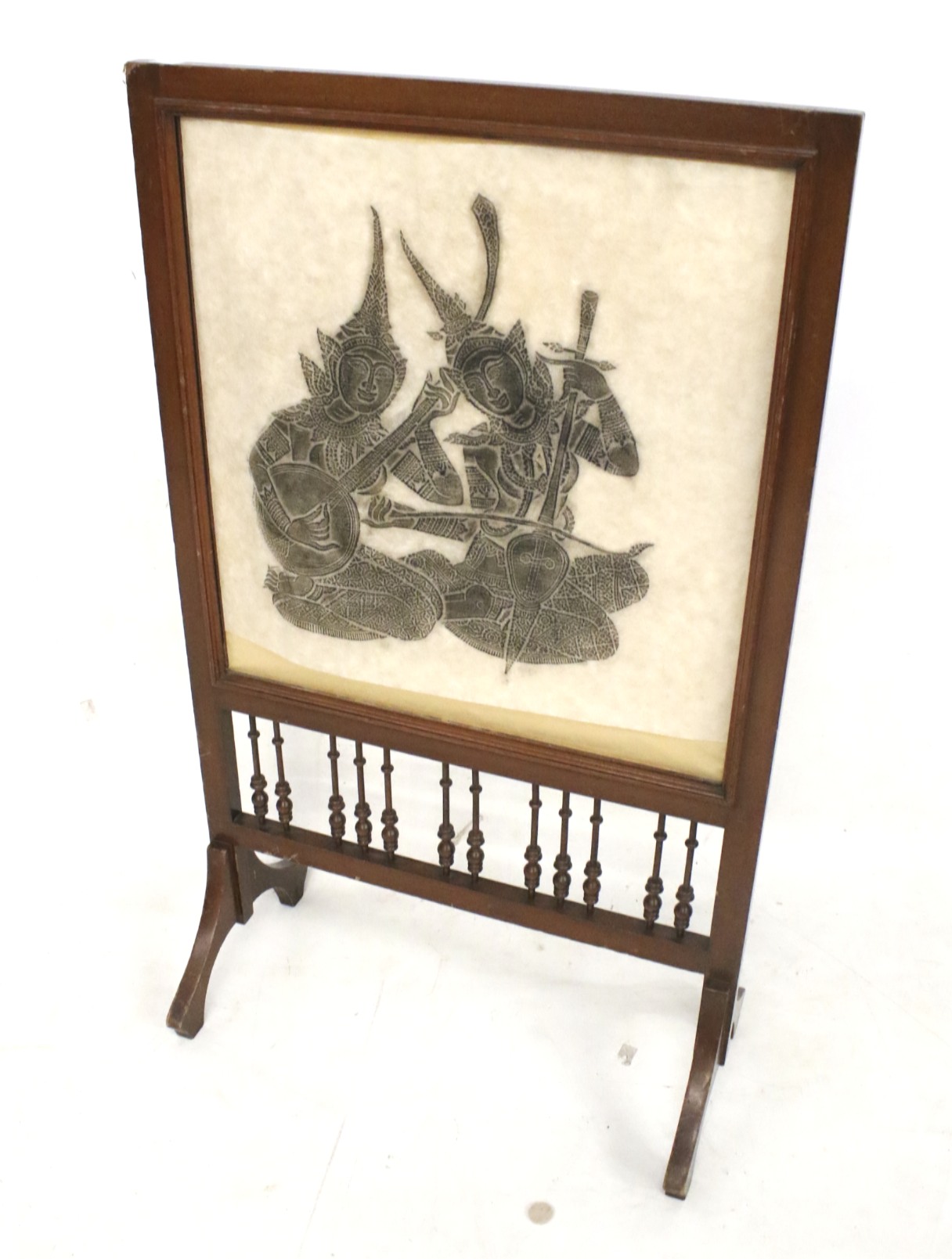 A wooden framed fire screen. Featuring a picture of an Indian figure, raised on swept supports, H93.