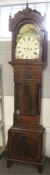 A mahogany inlaid long case clock. The face signed 'Harris, Westbury'.