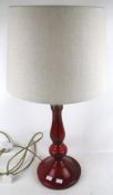 A contemporary ruby glass table lamp.