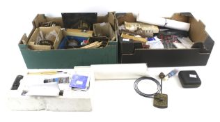 An assortment of clock restoration components and tools.