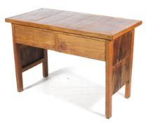 A hardwood two drawer desk.