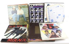 A collection of vintage records, dvds and cds. Including the Beatles, Elton John, etc.