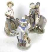 Three Lladro 'Daisa' porcelain figures. Including an elephant. Max.