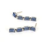 A pair of blue synthetic-spinel four-stone pendent earrings.