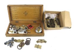 An assortment of hardware. Including padlocks, brass handles, etc.