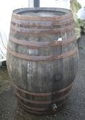 An extra large wooden coopered beer barrel.