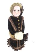 An early 20th century German Armand Marseille bisque headed doll.